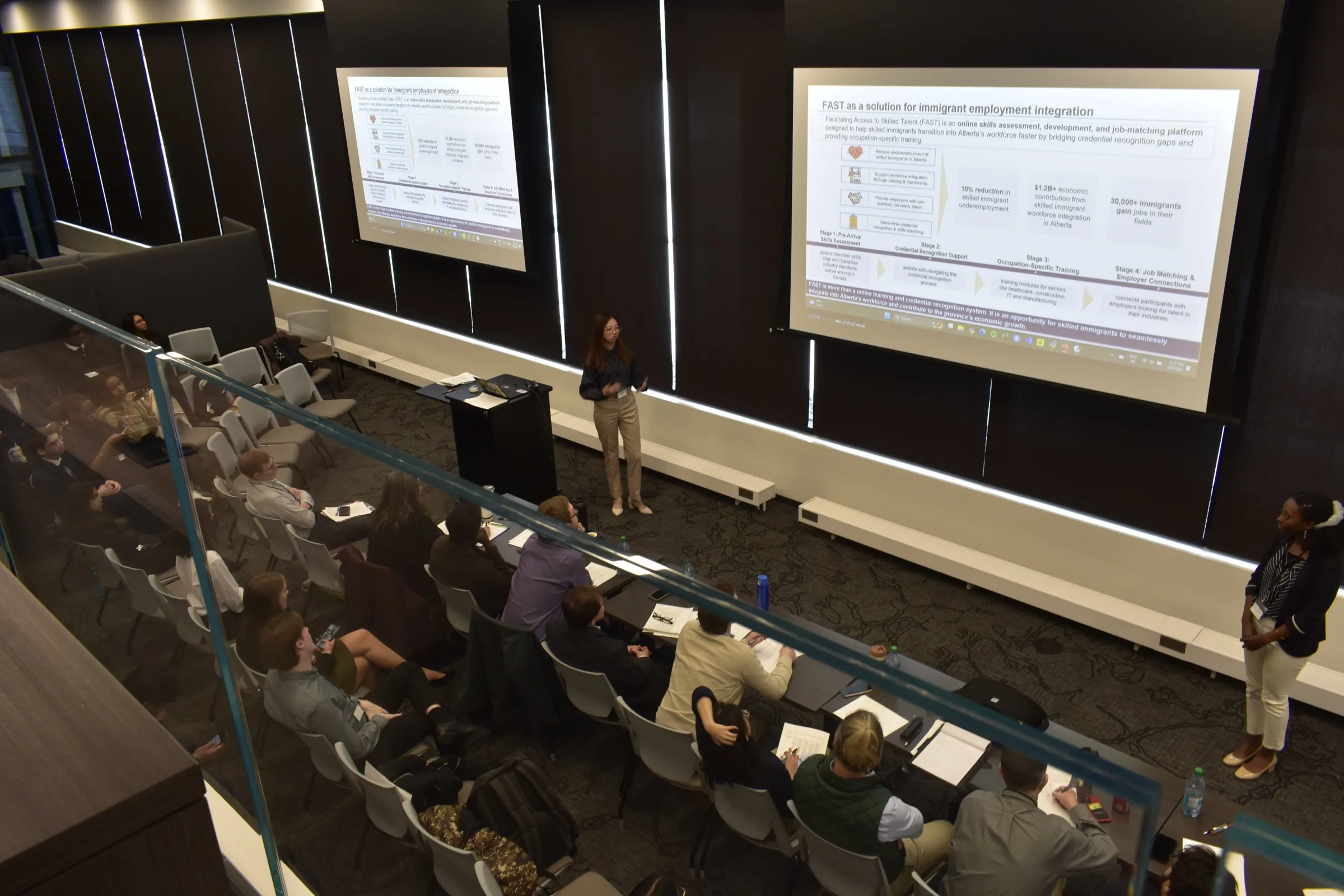 ESA members presenting to an audience at a case competition